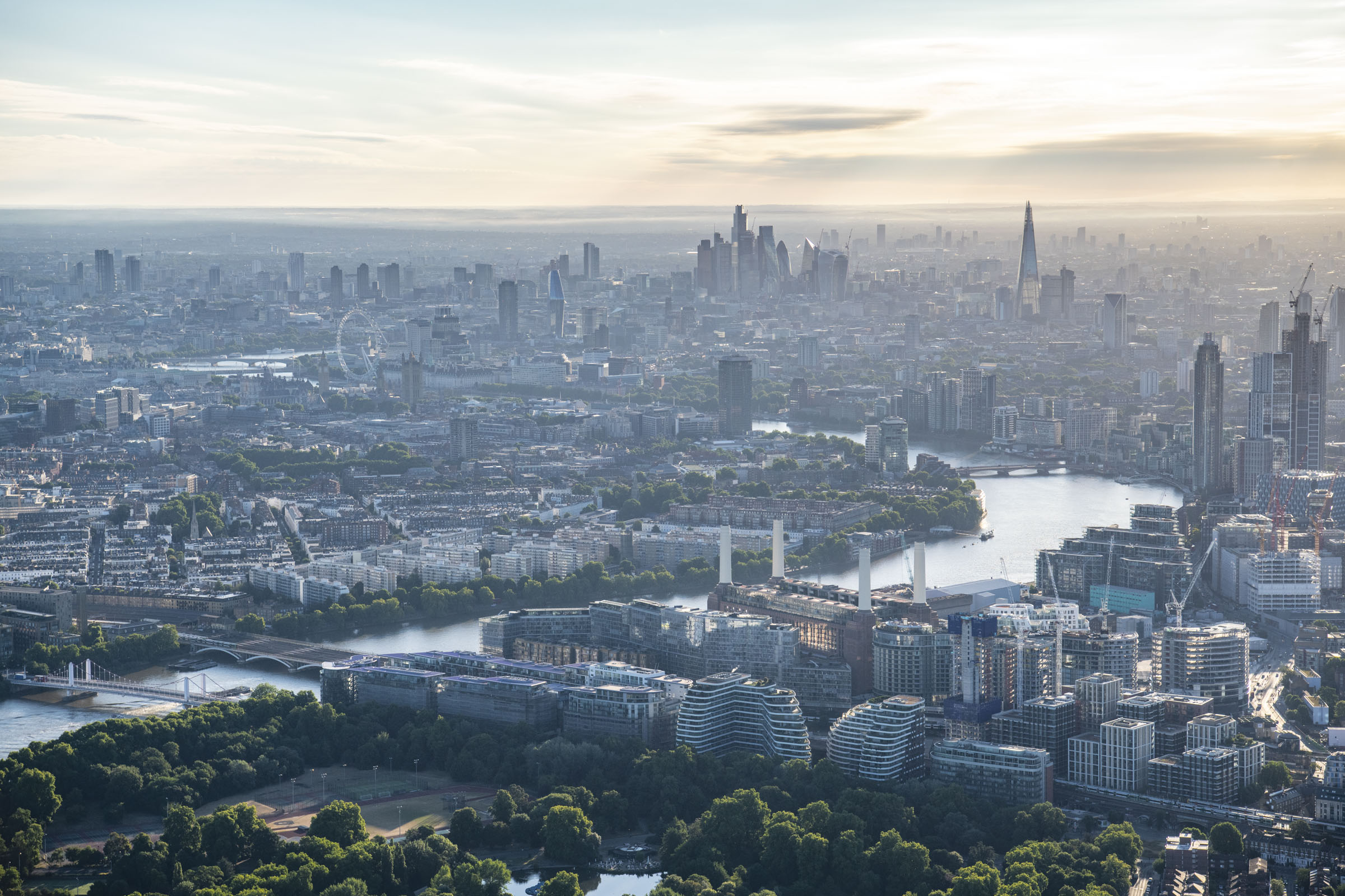 Dawn aerial view of Battersea park, Battersea, Nine Elms, River Thames, London. 